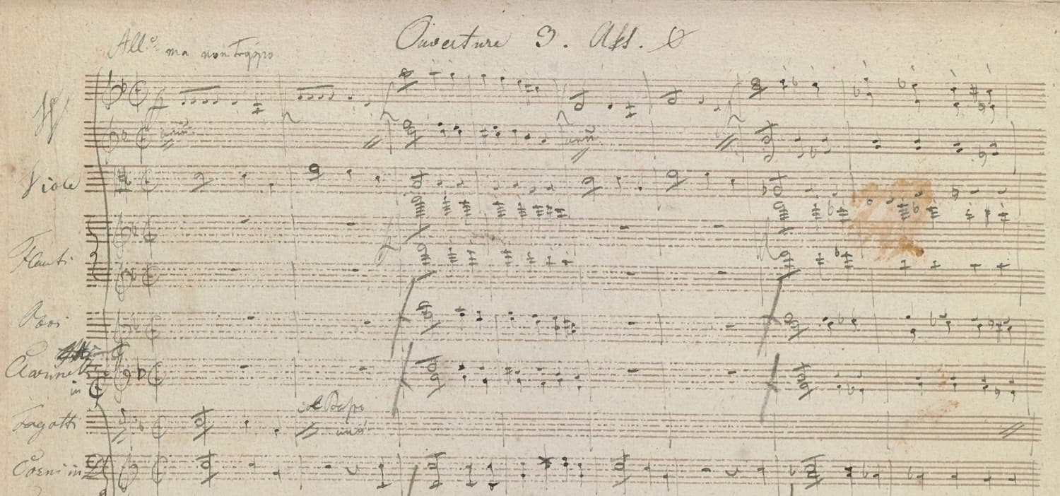 A yellowed, fIrst page of Zauberharfe manuscript score, with "Ouverture 3" written at the top.